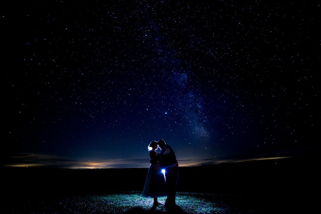 Newlywed couple under the Milky Way night sky at Huser Farm rustic wedding venue in Wisconsin