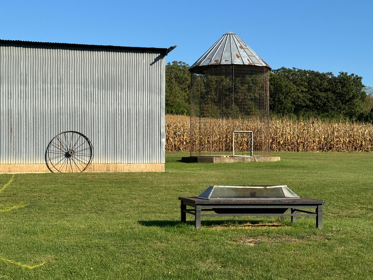 Rustic corn silo near the outdoor wedding ceremony area at Huser Farm