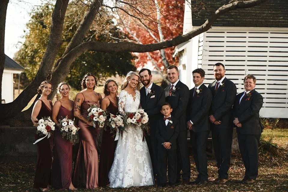Wedding party in front of the corn crib during a rustic Wisconsin fall wedding at Huser Farm